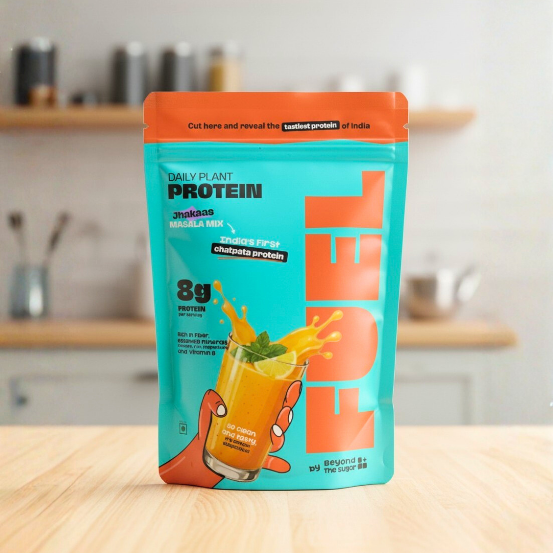 Protein powder package with orange and blue design on a kitchen counter